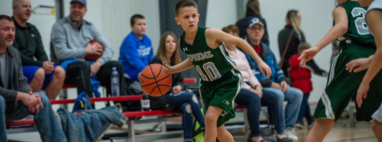 Southwest Supreme player dribbling down side