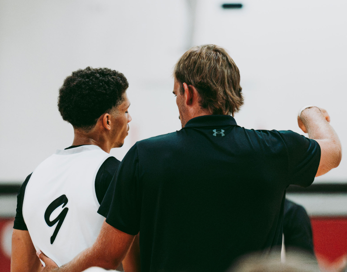 Coach Instructing Player